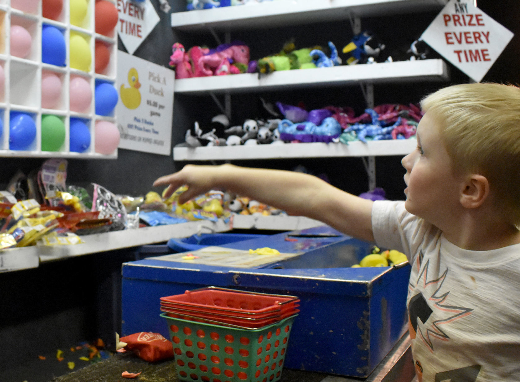 Camden, 6, pops balloons at fair
